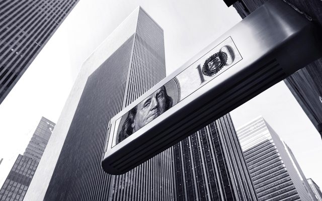 Dollar sign in front of skyscrapers