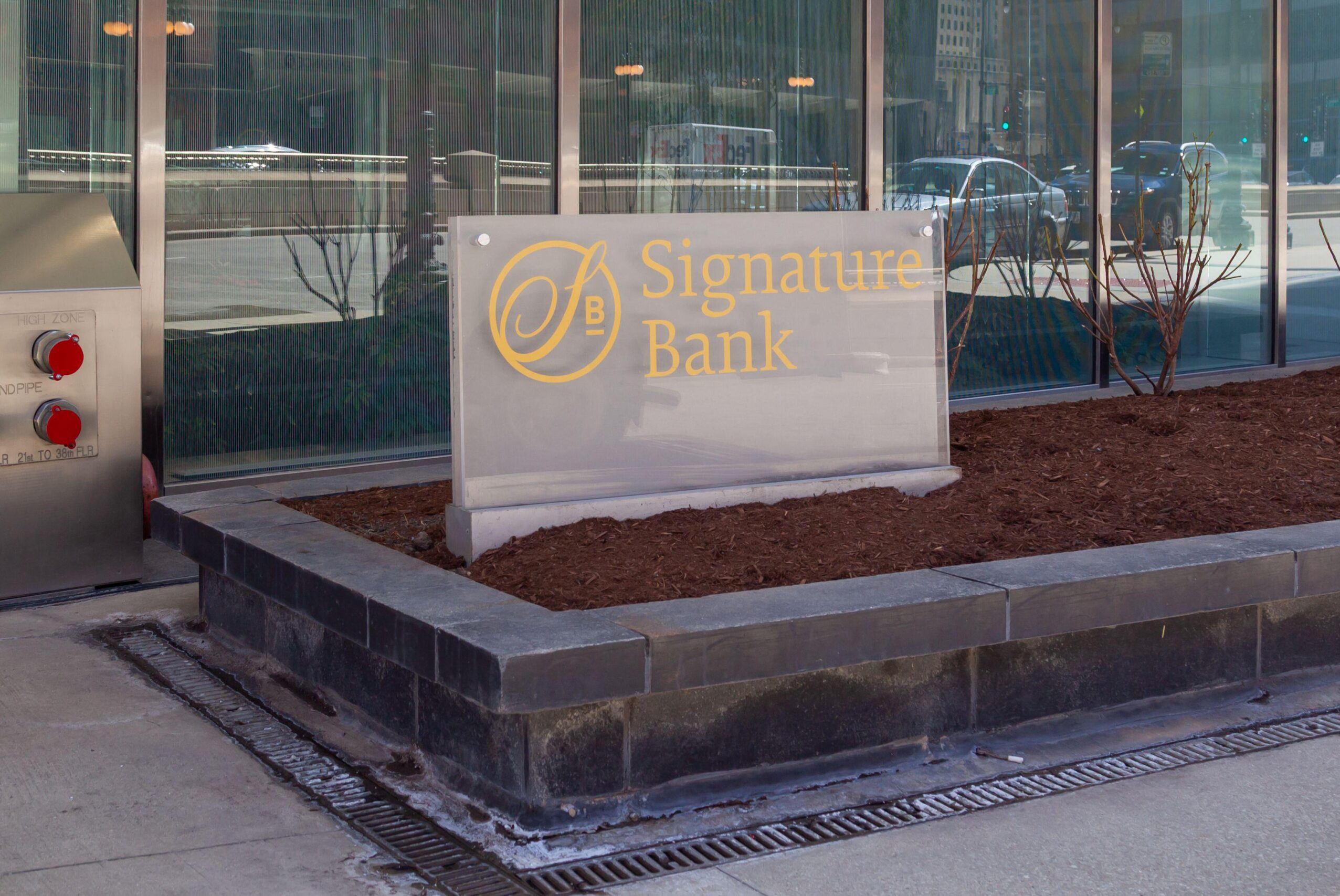 A ground sign for Signature Bank outside the office building in downtown Chicago, Illinois, USA.